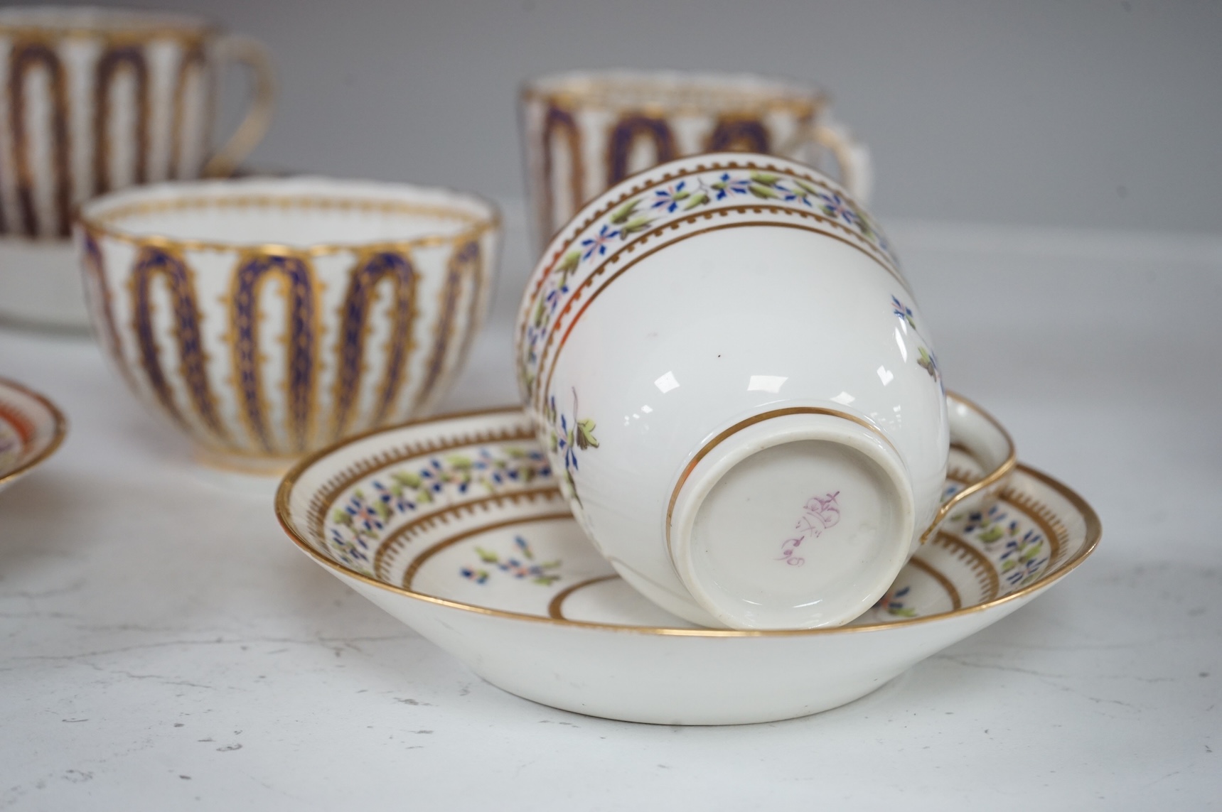 Two late 18th century Derby cornflower pattern coffee cups and saucers and Derby tea and coffee wares, largest 13cm in diameter